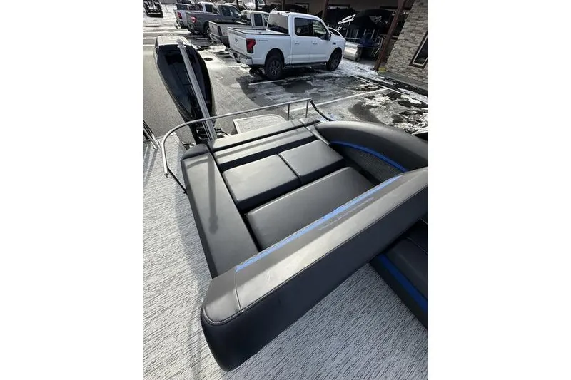 Slide: The Image of 2025 Bennington M Swingback 26 MSB boat with sleek seating and modern design. - 25