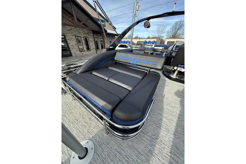 Slide: The Image of 2025 Bennington M Swingback 26 MSB boat with luxurious seating and modern design. - 26
