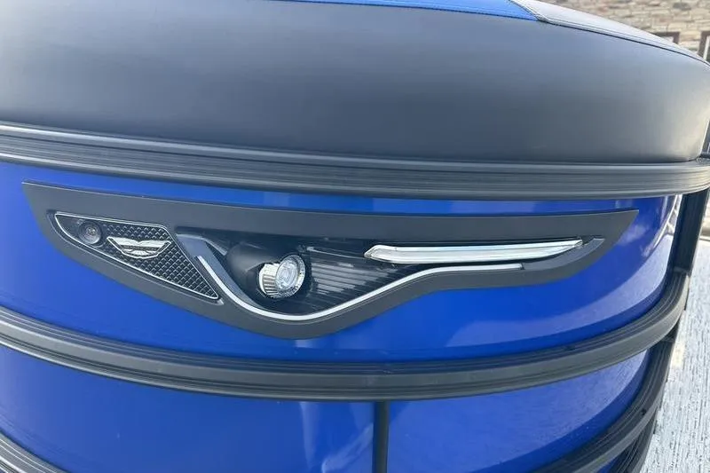 Slide: The Image of 2025 Bennington M Swingback 26 MSB pontoon boat with sleek blue exterior design. - 6