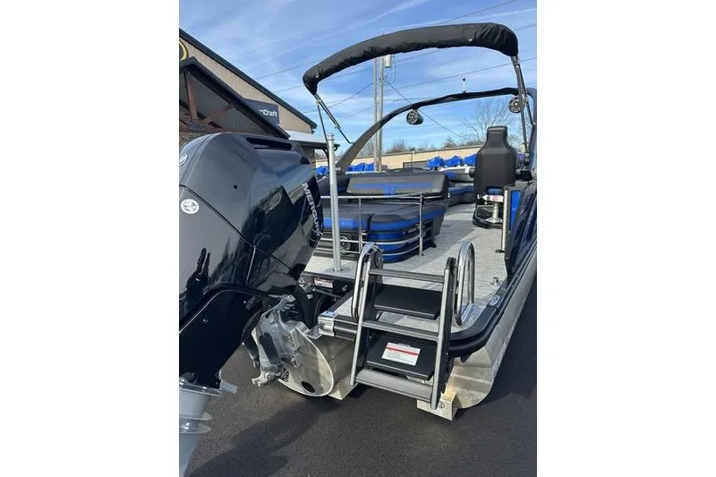 Slide: The Image of 2025 Bennington M Swingback 26 MSB pontoon boat with outboard motor and swim ladder. - 8