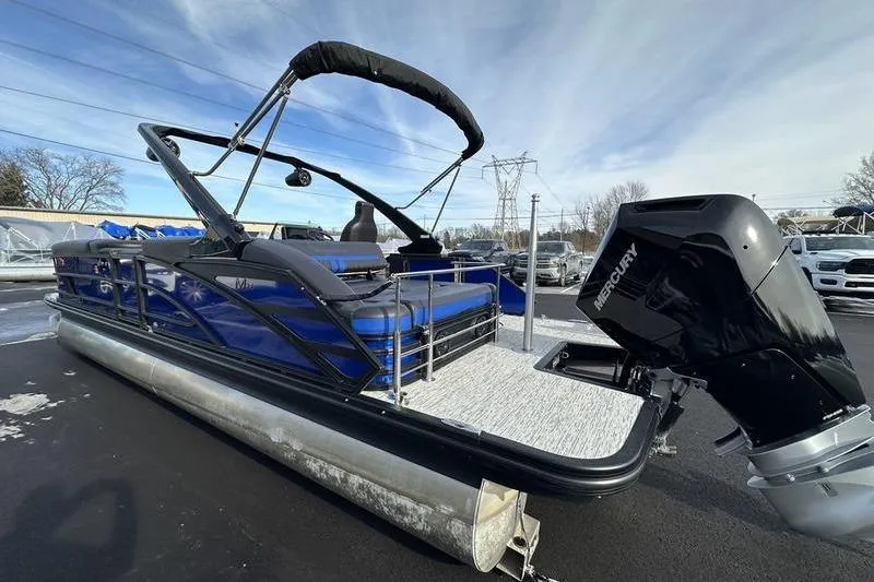 Slide: The Image of 2025 Bennington M Swingback 26 MSB pontoon boat with Mercury outboard motor. - 9