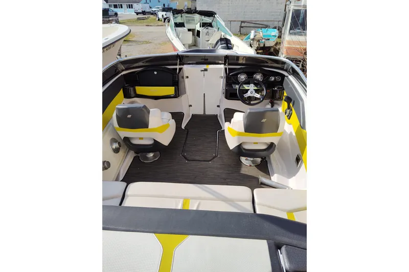 Slide: The Image of 2017 Four Winns 200 Horizon LE boat interior with dual seats and steering console. - 10