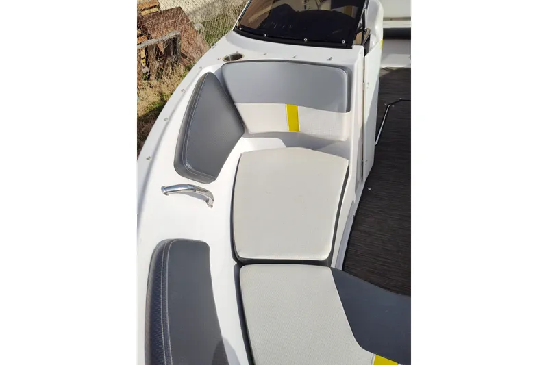 Slide: The Image of 2017 Four Winns 200 Horizon LE boat interior seating with gray and yellow accents. - 5