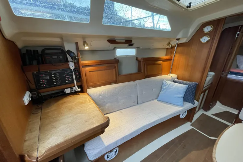 Slide: The Image of Cozy interior of a 1992 Hunter 33.5 sailboat with a comfortable seating area. - 20