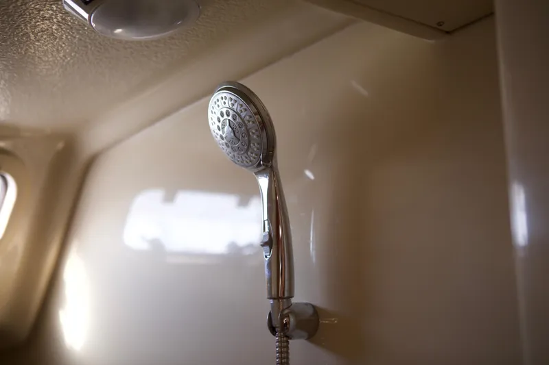 Slide: The Image of Showerhead in 1992 Hunter 33.5 yacht bathroom, featuring sleek chrome design. - 22