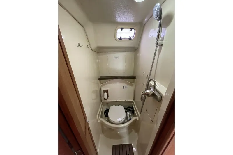 Slide: The Image of Compact bathroom in 1992 Hunter 33.5 sailboat with shower and toilet. - 23