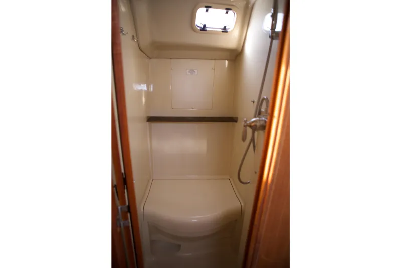 Slide: The Image of Interior of 1992 Hunter 33.5 sailboat bathroom with shower and window. - 25