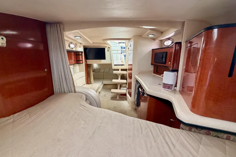Slide: The Image of Luxurious interior of a 2005 Sea Ray 300 Sundancer yacht with modern amenities. - 36