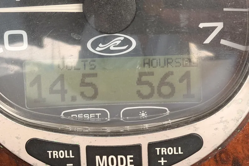 Slide: The Image of Close-up of a 2005 Sea Ray 300 Sundancer gauge showing 14.5 volts and 561 hours. - 45
