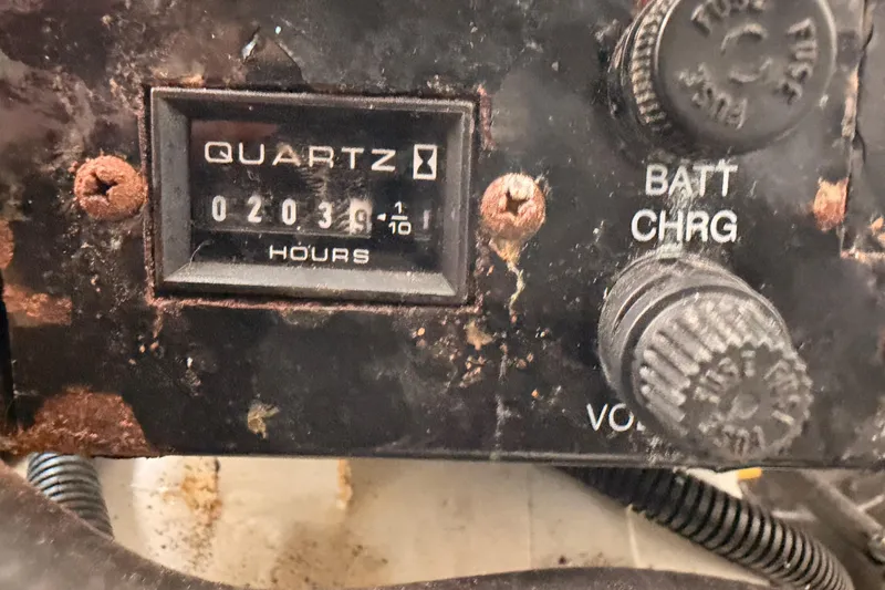 Slide: The Image of Close-up of a 2005 Sea Ray 300 Sundancer engine hour meter showing 2039 hours. - 48