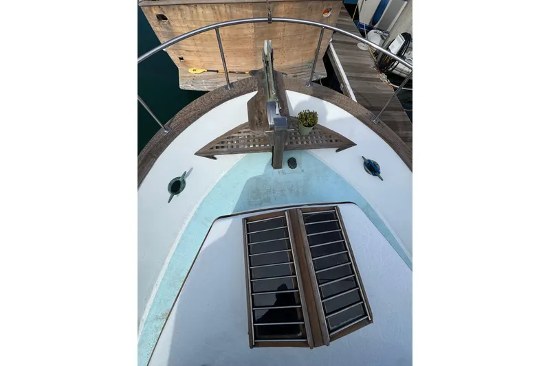 Slide: The Image of Bow view of a 1978 CHB 35 boat with wooden deck details. - 12