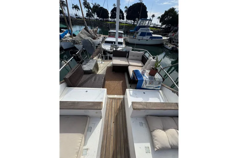 Slide: The Image of 1978 CHB 35 boat with outdoor seating, docked in a marina. - 13