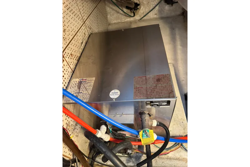Slide: The Image of 1978 CHB 35 engine compartment with metal box and colorful wiring. - 41