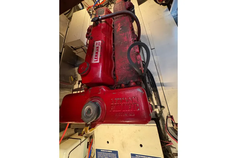 Slide: The Image of 1978 CHB 35 boat engine, Lehman diesel, red, in engine room. - 43