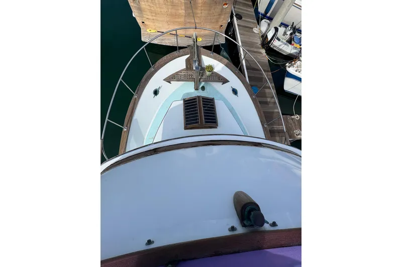 Slide: The Image of Aerial view of 1978 CHB 35 boat docked at marina. - 7