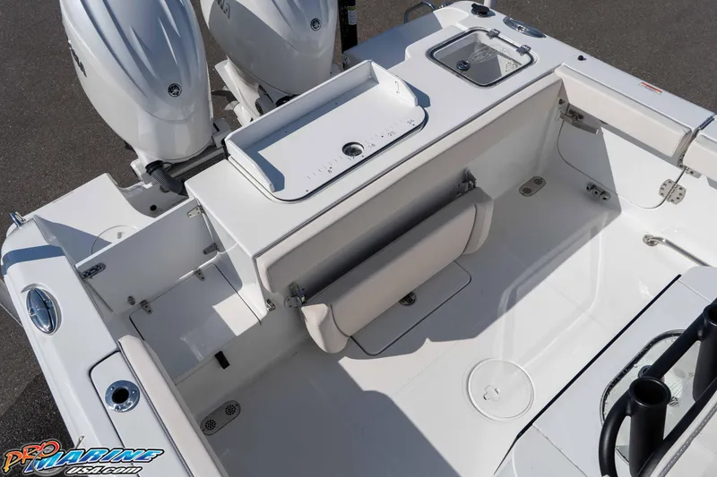 Slide: The Image of 2025 Sea Hunt Gamefish 25 boat interior with dual engines and seating area. - 19