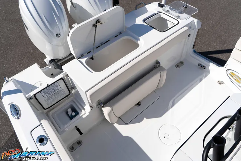 Slide: The Image of 2025 Sea Hunt Gamefish 25 boat interior with storage compartments and Yamaha engines. - 20
