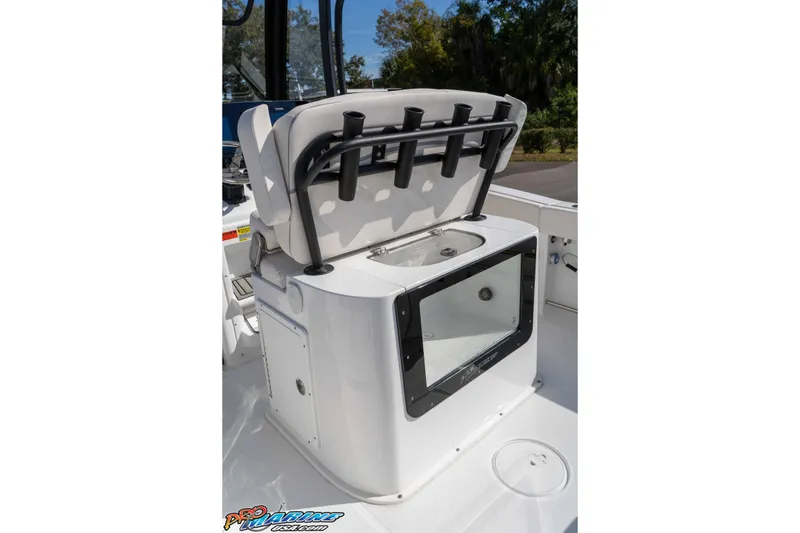 Slide: The Image of 2025 Sea Hunt Gamefish 25 boat with open storage compartment and rod holders. - 21