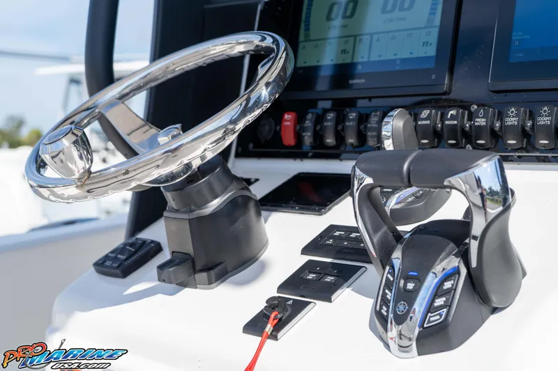 Slide: The Image of Steering console of 2025 Sea Hunt Gamefish 25 boat with modern controls and displays. - 26
