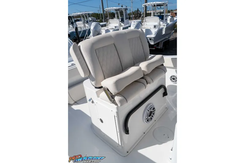 Slide: The Image of 2025 Sea Hunt Gamefish 25 boat seating with cushioned backrest and integrated speaker. - 27