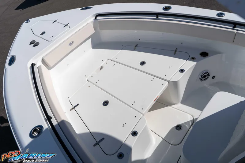 Slide: The Image of 2025 Sea Hunt Gamefish 25 boat interior with spacious seating and storage compartments. - 29