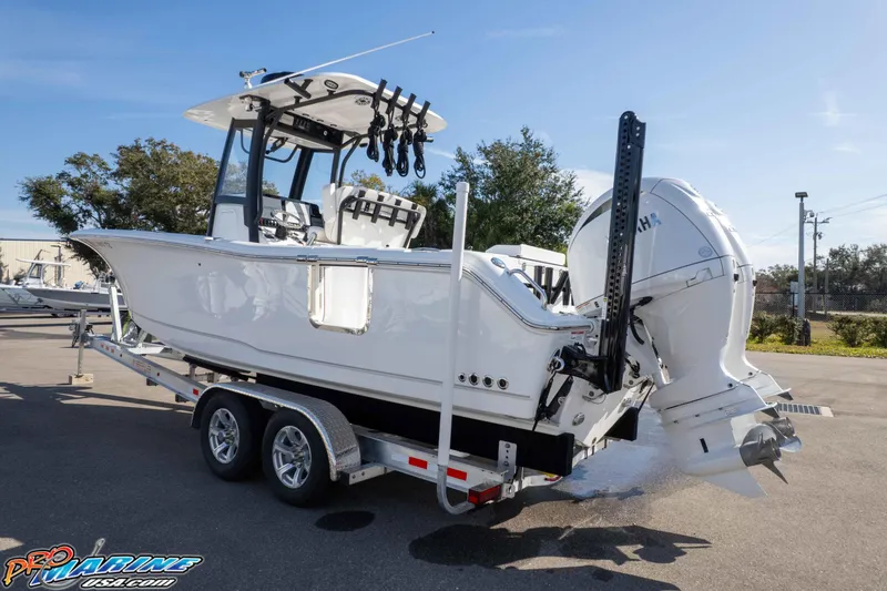 Slide: The Image of 2025 Sea Hunt Gamefish 25 boat on trailer, featuring dual engines and sleek design. - 43