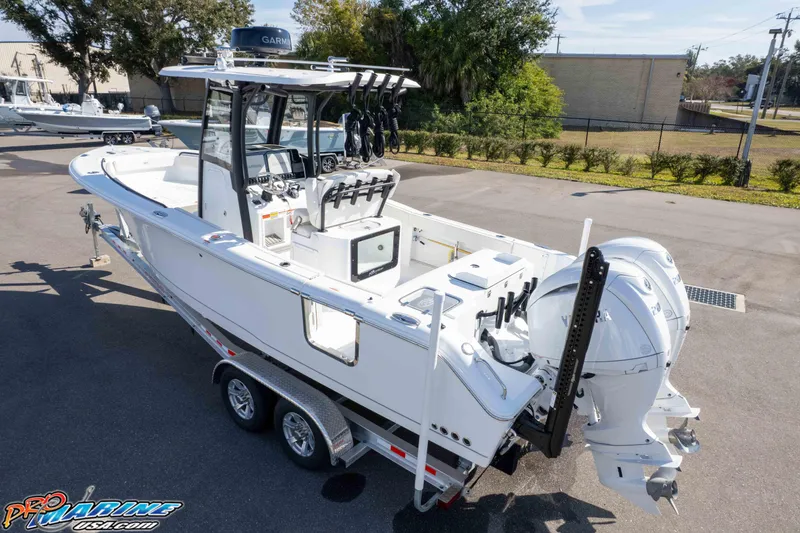 Slide: The Image of 2025 Sea Hunt Gamefish 25 boat on trailer, featuring dual Yamaha engines. - 44