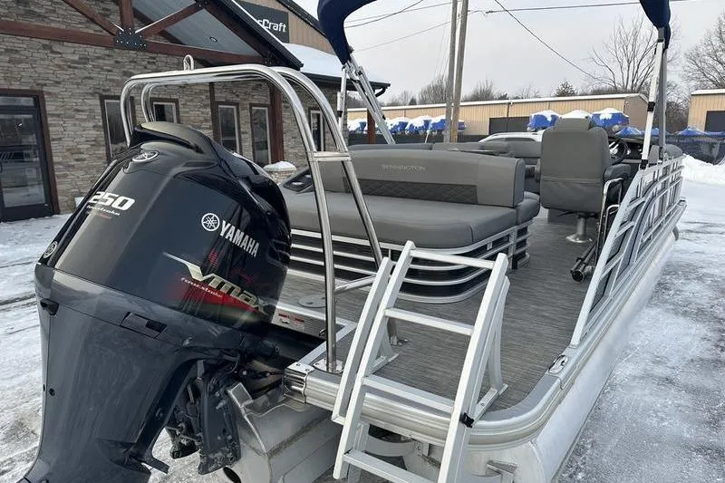 Slide: The Image of 2021 Bennington 23 LSB pontoon boat with Yamaha 250 engine, parked on snowy ground. - 10