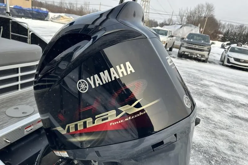 Slide: The Image of Yamaha VMAX outboard motor on 2021 Bennington 23 LSB boat in snowy setting. - 13