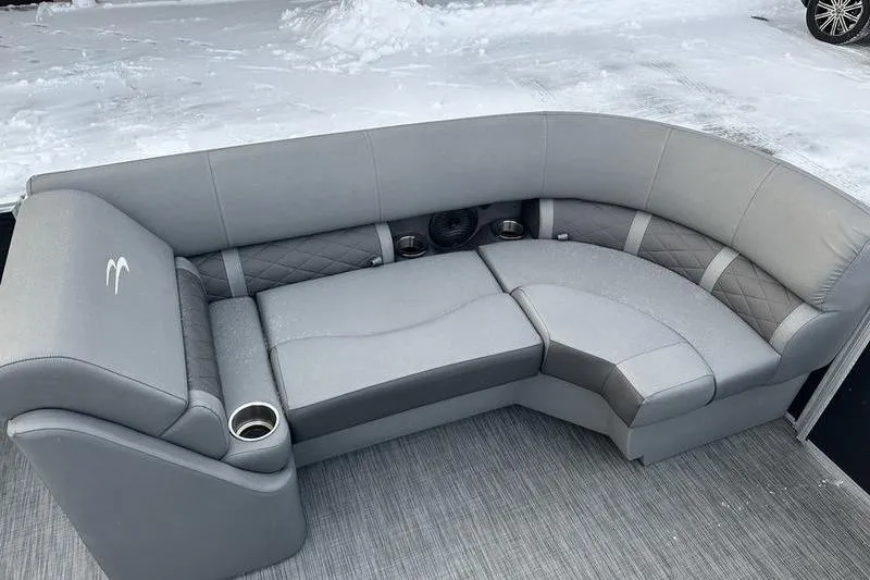 Slide: The Image of Gray seating area on a 2021 Bennington 23 LSB boat, with cup holders and snow. - 23