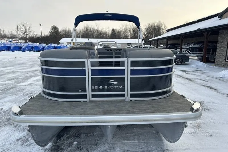 Slide: The Image of 2021 Bennington 23 LSB pontoon boat in snowy outdoor setting. - 7