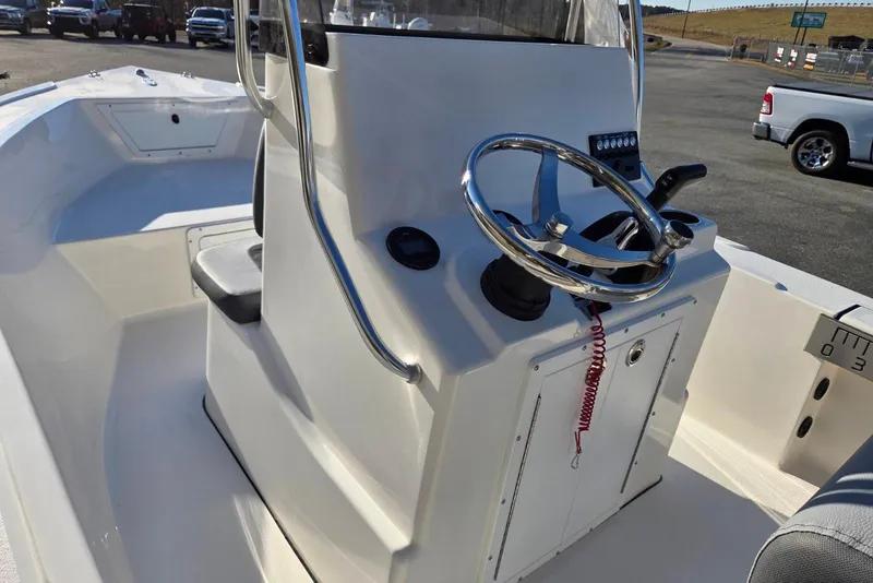 Slide: The Image of 2026 May-Craft 182 Center Console boat with steering wheel and control panel. - 11