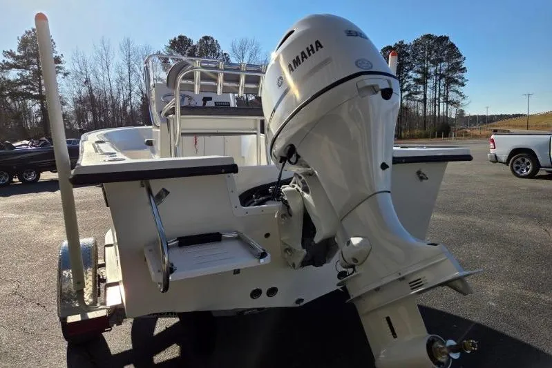 Slide: The Image of 2026 May-Craft 182 Center Console boat with Yamaha outboard motor in a parking lot. - 3