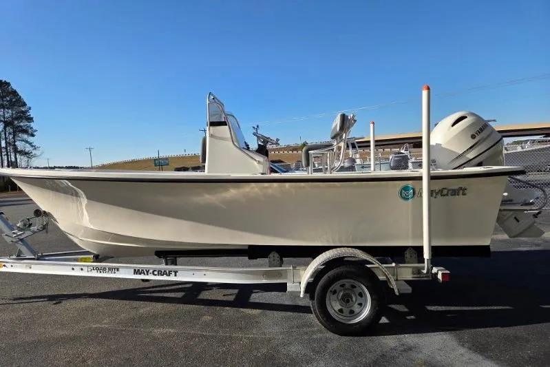 Slide: The Image of 2026 May-Craft 182 Center Console boat on trailer, side view, outdoors. - 5
