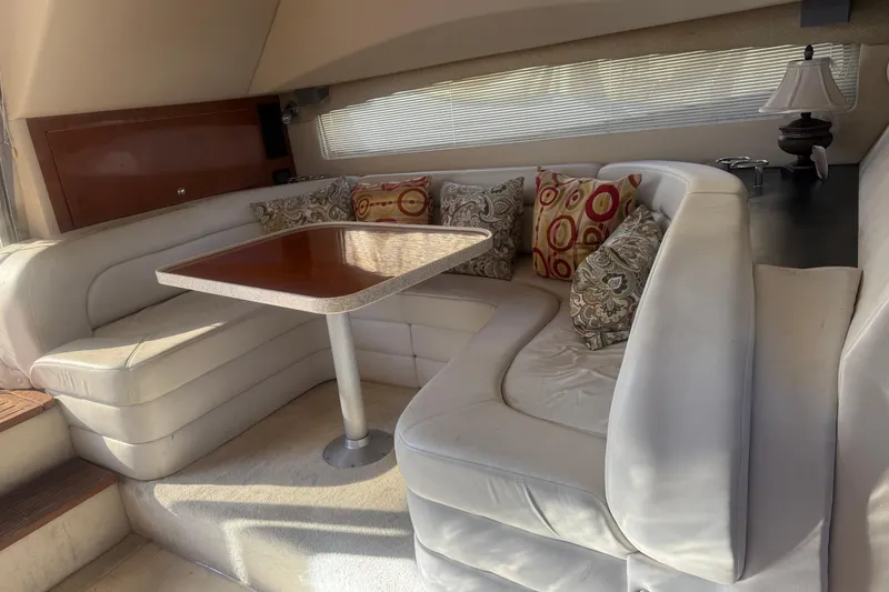 Slide: The Image of Luxurious interior of 2005 Regal Commodore 3880 yacht with plush seating and elegant table. - 13