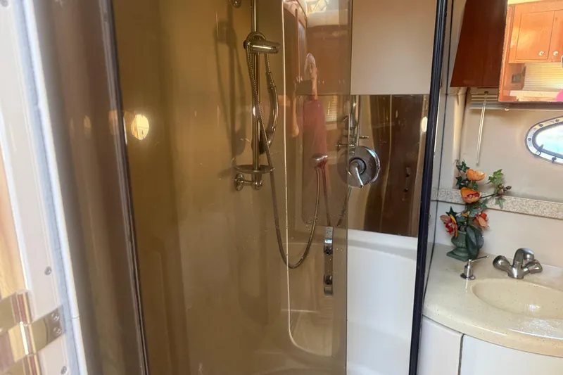 Slide: The Image of Bathroom interior of 2005 Regal Commodore 3880 yacht with shower and sink. - 19