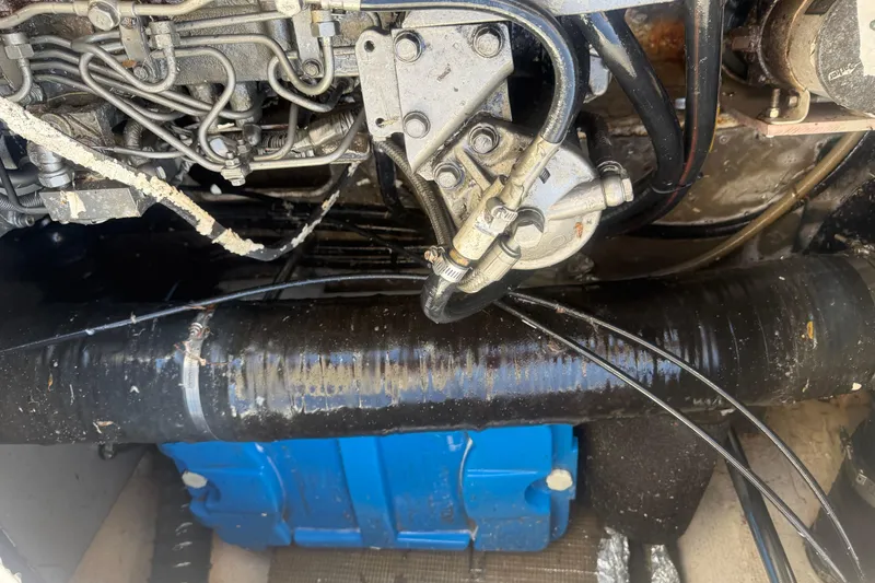 Slide: The Image of Engine compartment of a 2005 Regal Commodore 3880 boat, showing mechanical components and wiring. - 21