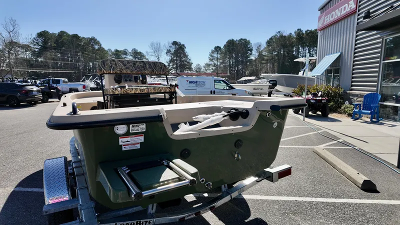 Slide: The Image of 2025 Carolina Skiff E18 JVX CC boat on trailer in parking lot. - 7