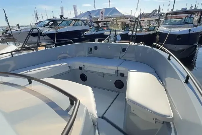 Slide: The Image of 2025 Targa 37 boat interior with spacious seating at a marina. - 12