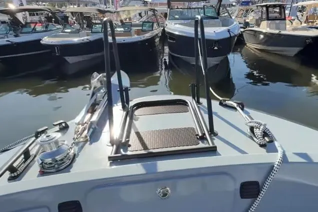 Slide: The Image of 2025 Targa 37 boat docked among other vessels at a marina. - 13