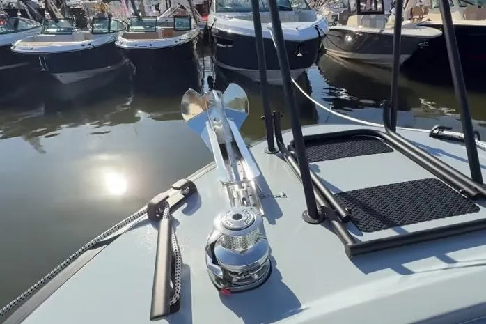 Slide: The Image of Bow of 2025 Targa 37 boat with anchor and winch, docked among other boats. - 14