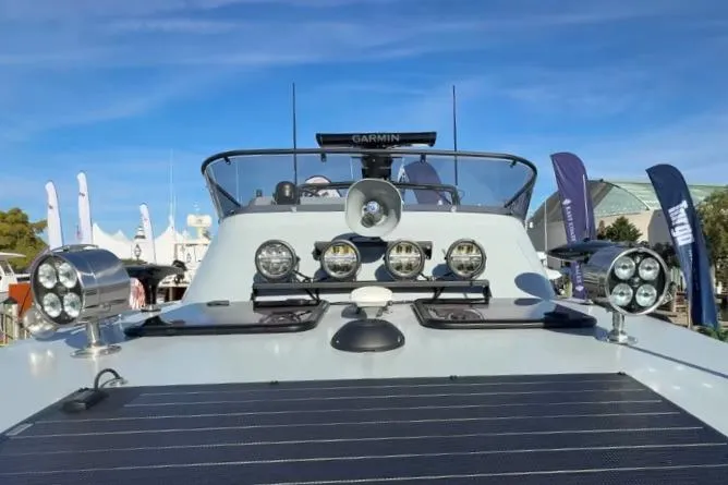 Slide: The Image of 2025 Targa 37 boat with advanced lighting and navigation systems at a marina. - 15