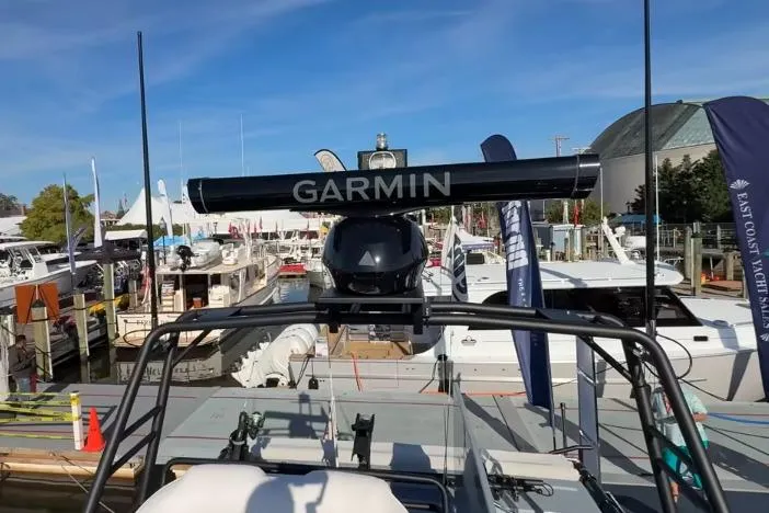 Slide: The Image of 2025 Targa 37 boat with Garmin equipment at a marina, showcasing modern marine technology. - 18