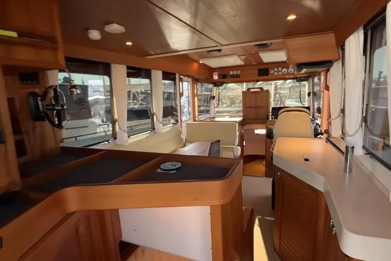 Slide: The Image of Luxurious interior of 2025 Targa 37 boat with wooden finishes and modern amenities. - 21
