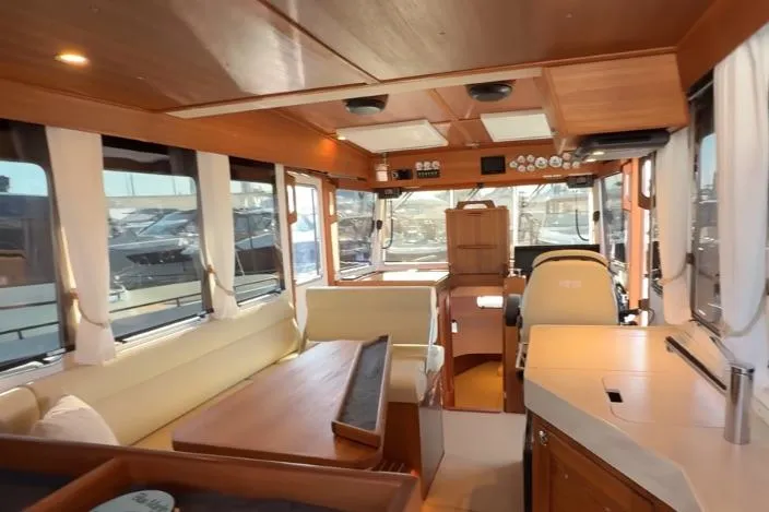 Slide: The Image of Interior of 2025 Targa 37 boat, featuring elegant wood finishes and spacious seating. - 22