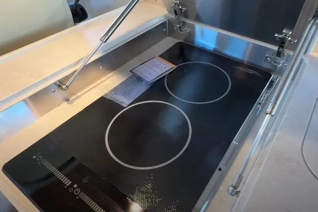 Slide: The Image of Modern induction cooktop in 2025 Targa 37 yacht kitchen. - 28