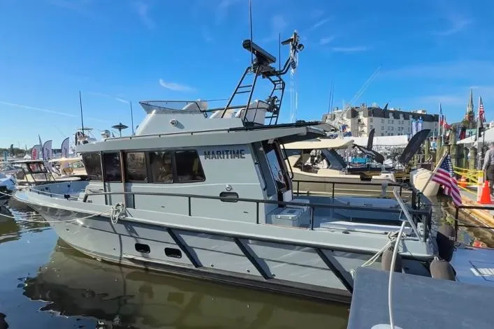 Slide: The Image of 2025 Targa 37 boat docked at marina, showcasing sleek design and modern features. - 3