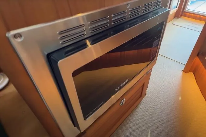 Slide: The Image of Built-in microwave in 2025 Targa 37 yacht interior, featuring sleek stainless steel design. - 30