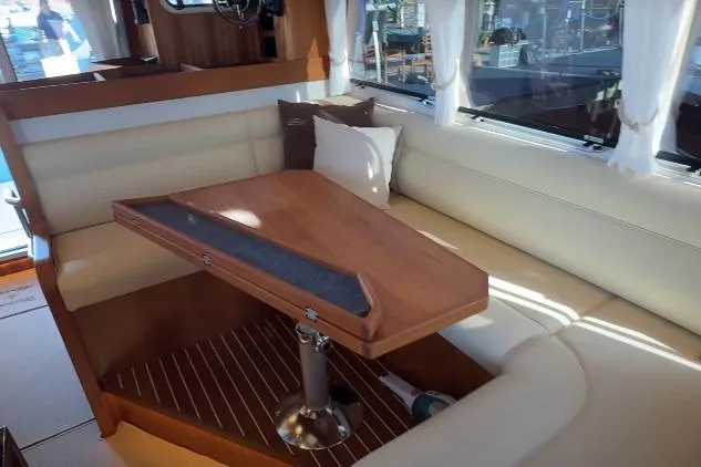 Slide: The Image of Luxurious interior of 2025 Targa 37 yacht with elegant seating and wooden table. - 31