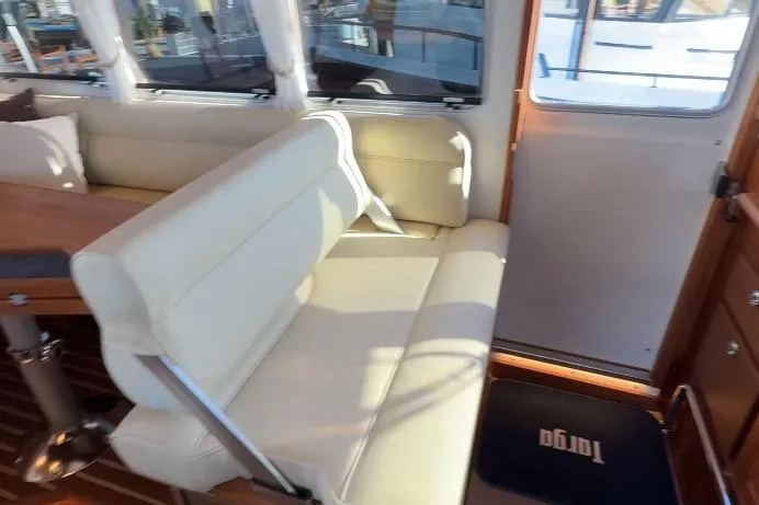 Slide: The Image of Interior of 2025 Targa 37 boat with beige seating and wooden accents. - 33